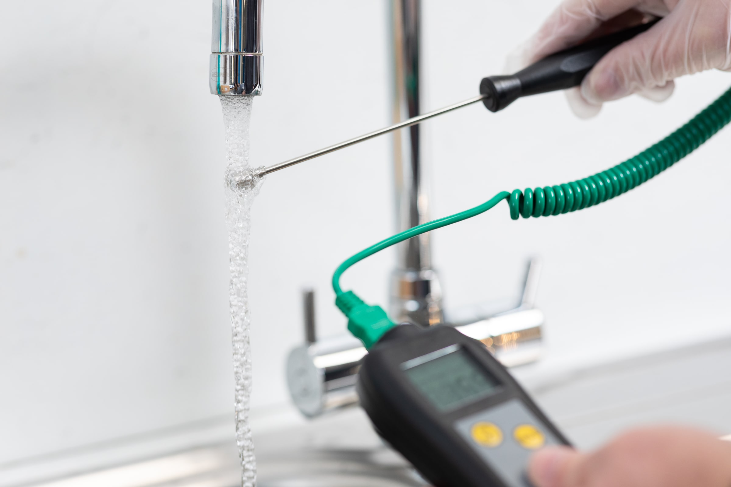 Assessor conducting Legionella risk assessment